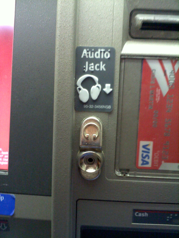 Audio Jack written in print and braille with a headphone icon and the headphone jack below.