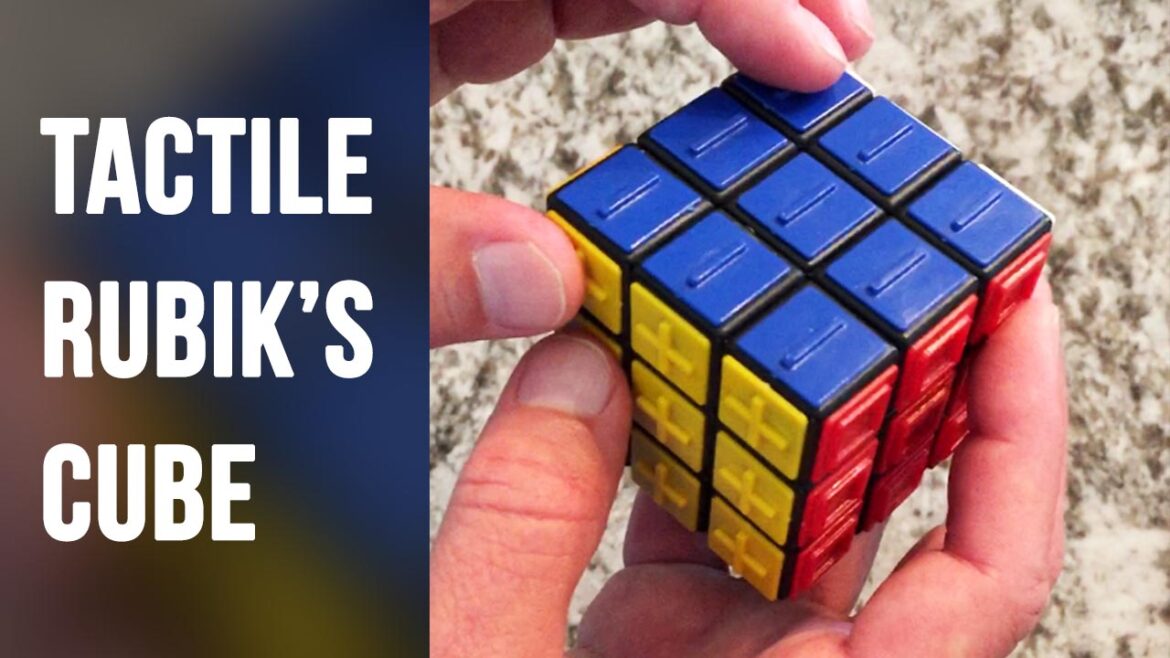 Tommy holds a tactile rubik's cube